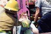 Victim being
                  backboarded.